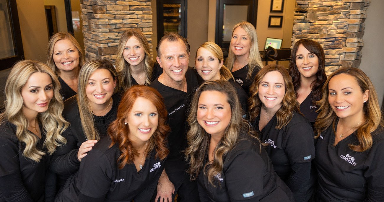 Smiling Novi dentist and dental team members at J M G Dentistry Family and Cosmetic Care