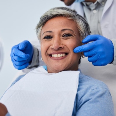 a patient smiling after undergoing cosmetic dentistry