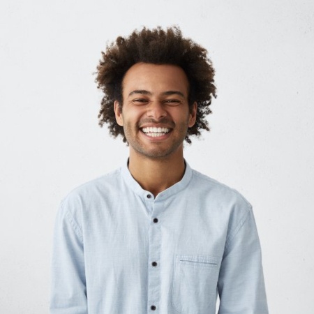 a man smiling with bright teeth