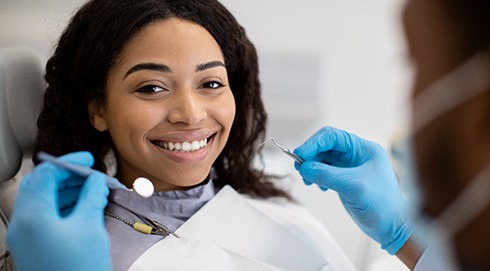 Woman smiling during dental exam